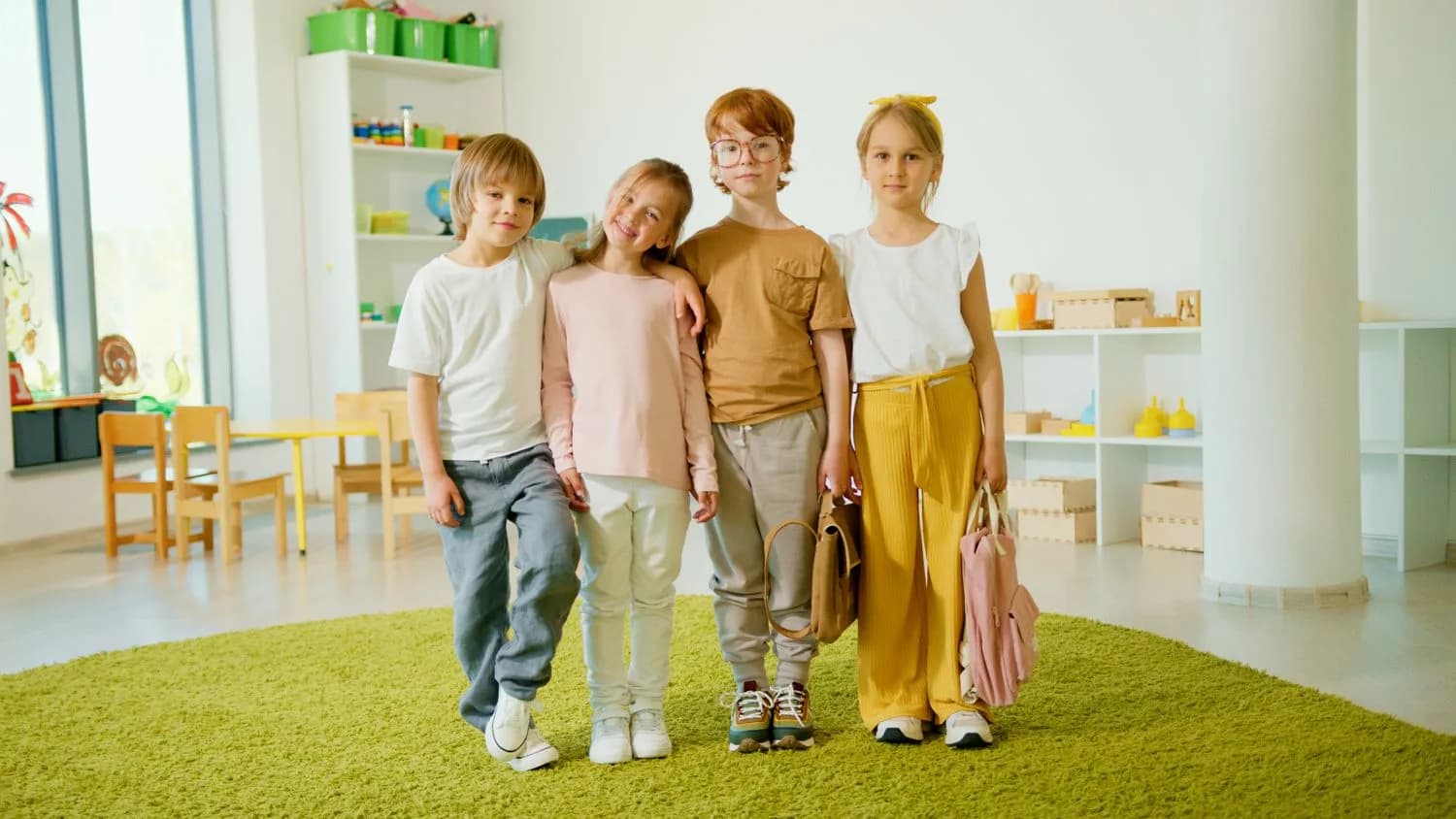 Four smiling children standing together